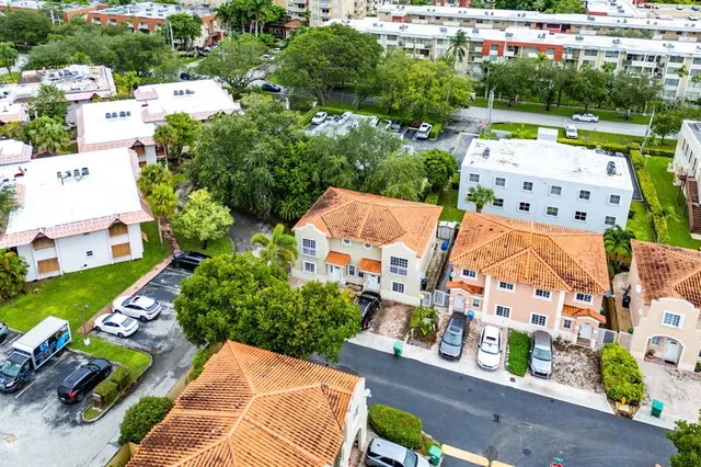 an aerial view of residential houses with outdoor space
