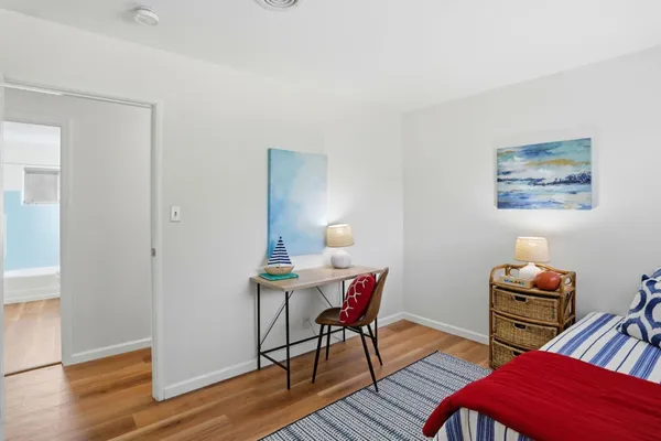 a workspace with furniture and wooden floor