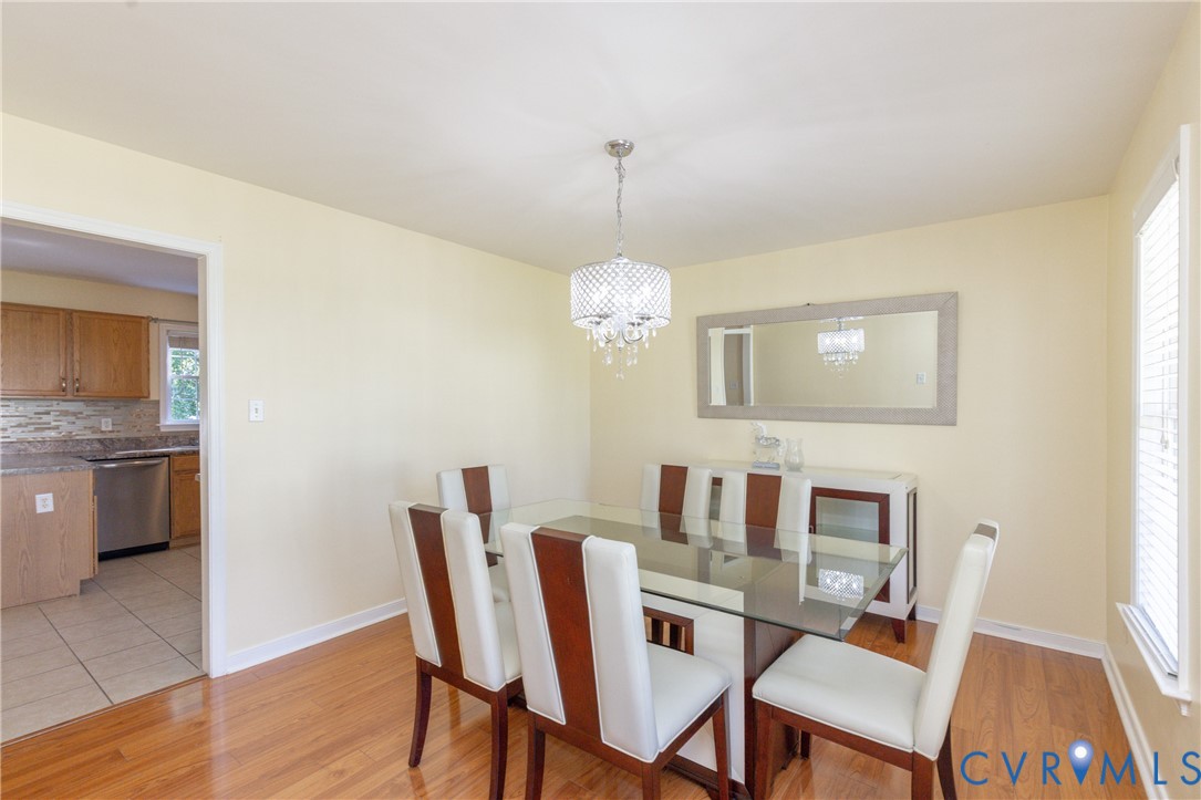 5101 Spring Bluff Road Midlothian, VA 23112 - Photo 24 of 47 Dining area featuring wood-finish flooring, a crys