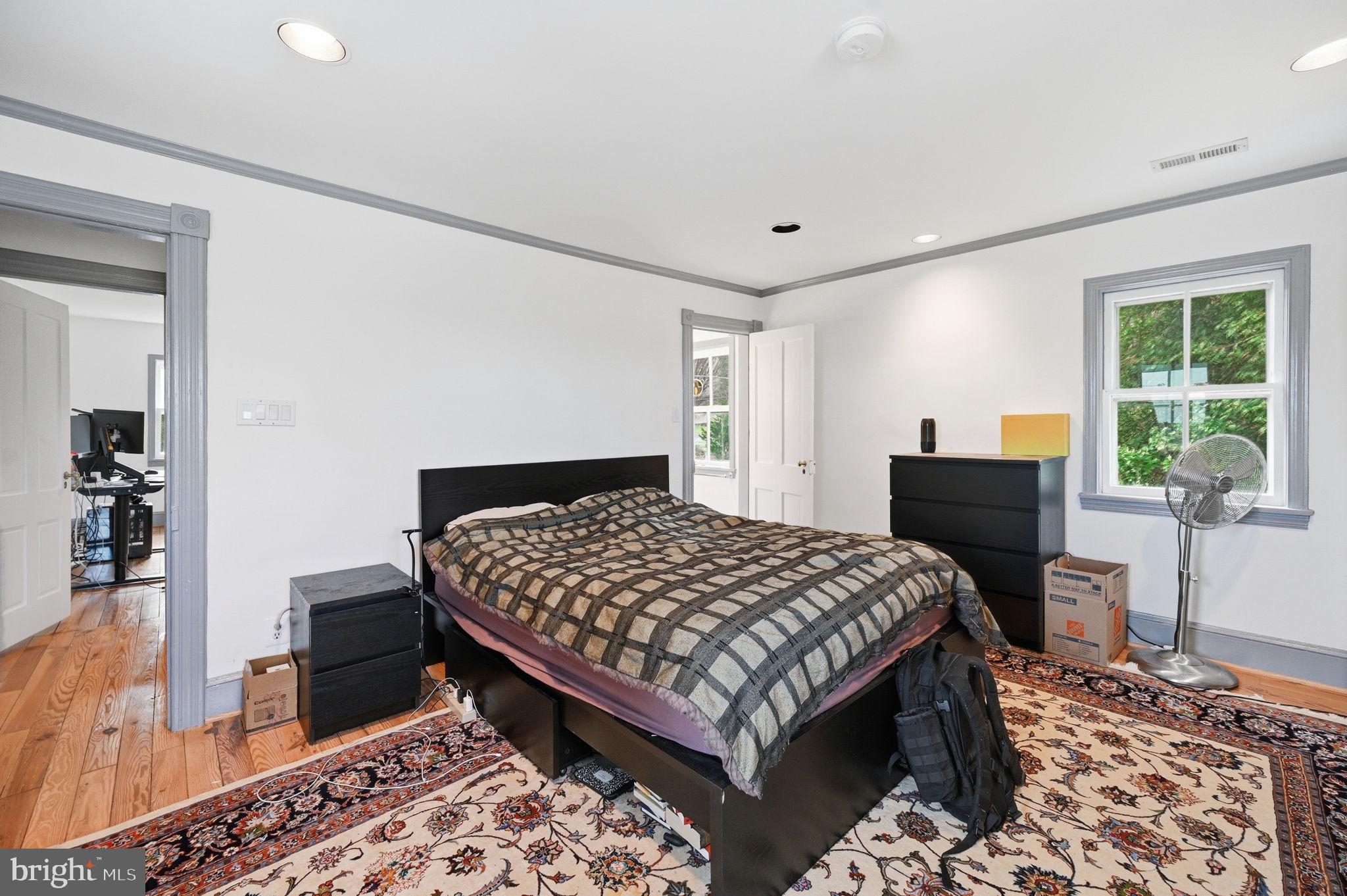 11641 Glen Road Potomac, MD 20854 - Photo 25 of 40 a bedroom with a bed and wooden floor