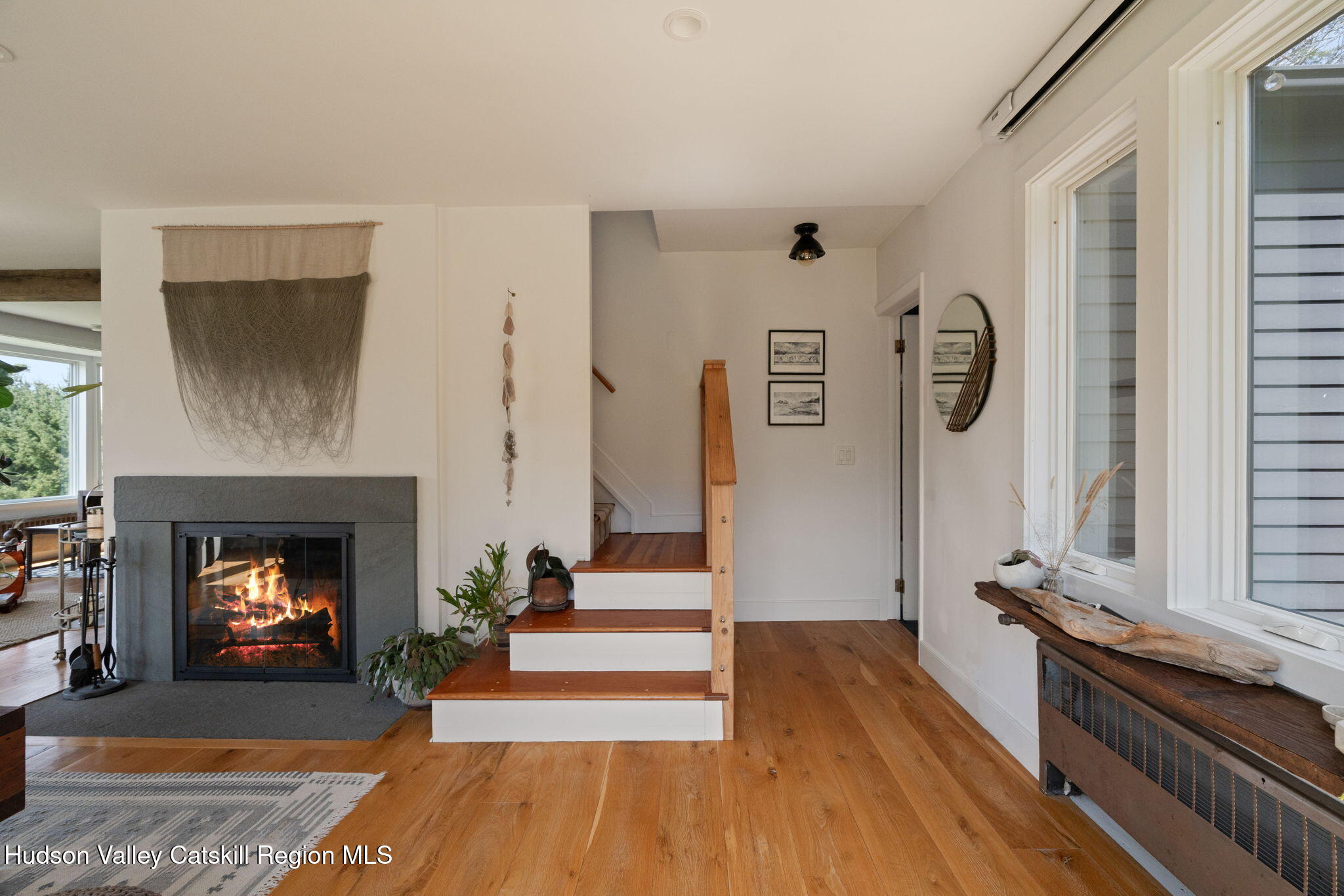 4701 Atwood Road Stone Ridge, NY 12484 - Photo 12 of 41 a living room with furniture and a fireplace