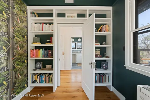 a room with a book shelf and a book shelf