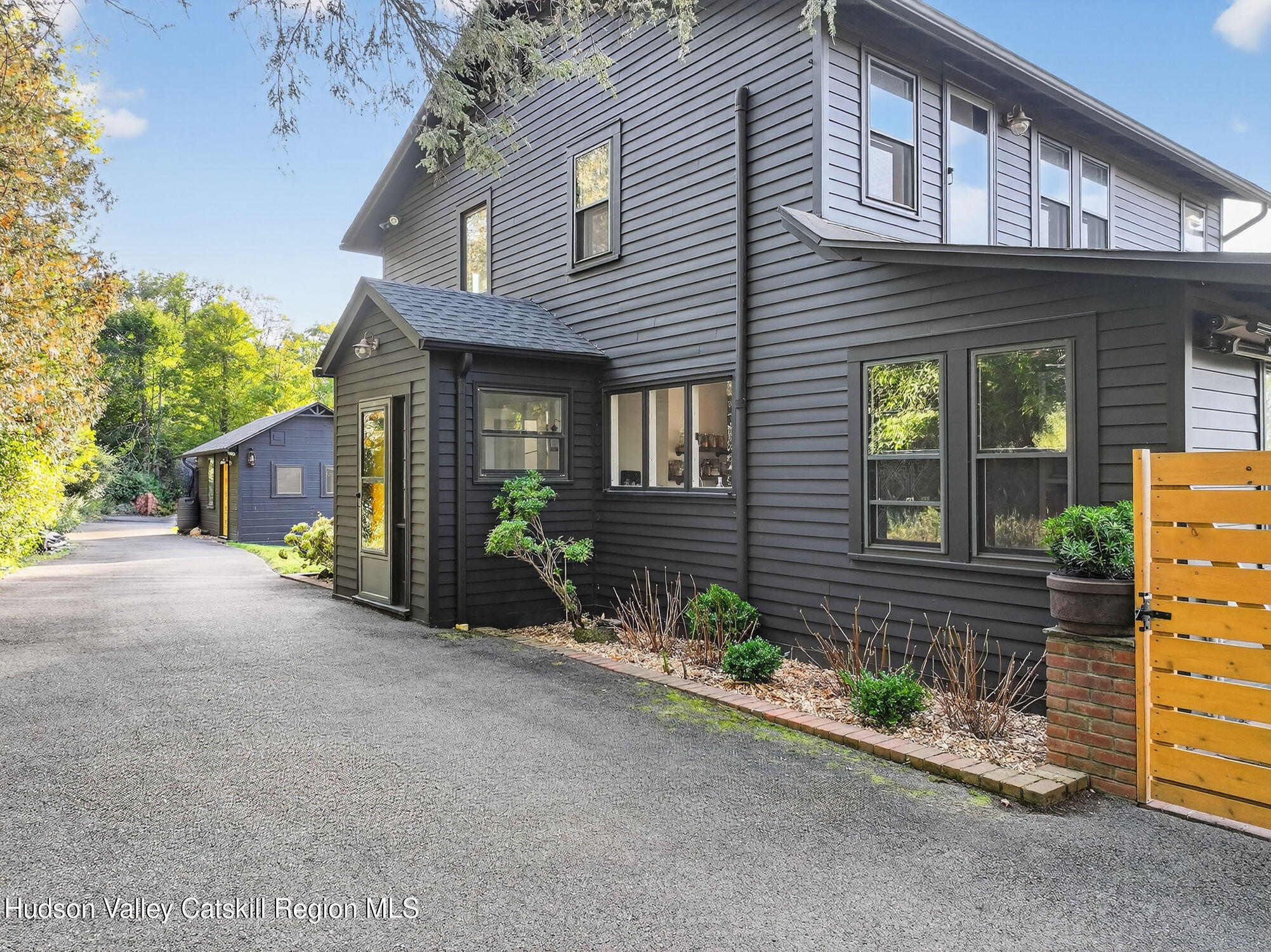 4701 Atwood Road Stone Ridge, NY 12484 - Photo 2 of 41 a view of a house with potted plants and a table