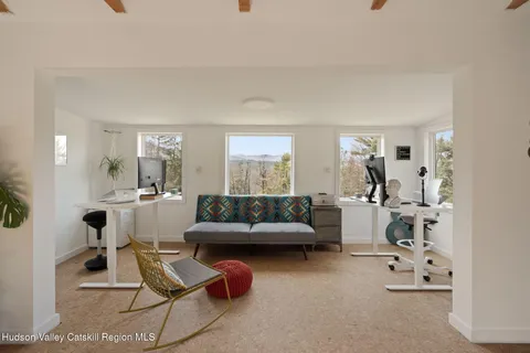 a living room with furniture and white walls