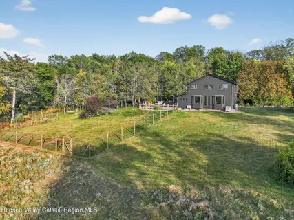 a view of a house with a big yard