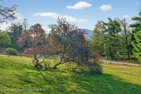 a view of a swimming pool and a yard