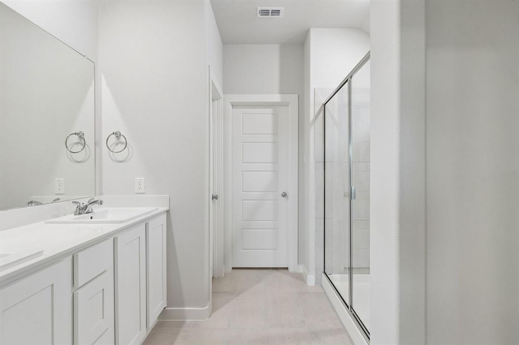 1140 Del Rio Drive Lavon, TX 75166 - Photo 18 of 32 Primary Bathroom in the Oscar home plan by Trophy Signature Homes – REPRESENTATIVE PHOTO