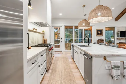 a outdoor space with patio fireplace couches and potted plants