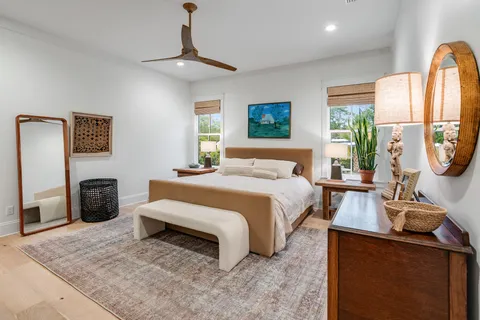 a bathroom with a bathtub and a painting on the wall