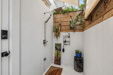 a bedroom with a large bed and a large window