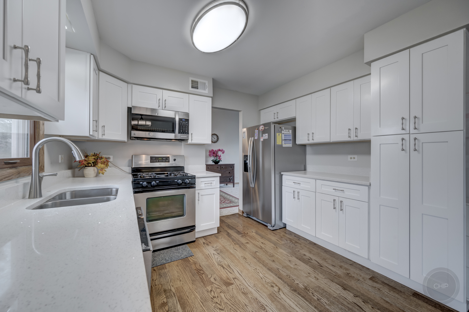 2820 Sun Valley Road Lisle, IL 60532 - Photo 23 of 46 a kitchen with granite countertop white cabinets and stainless steel appliances