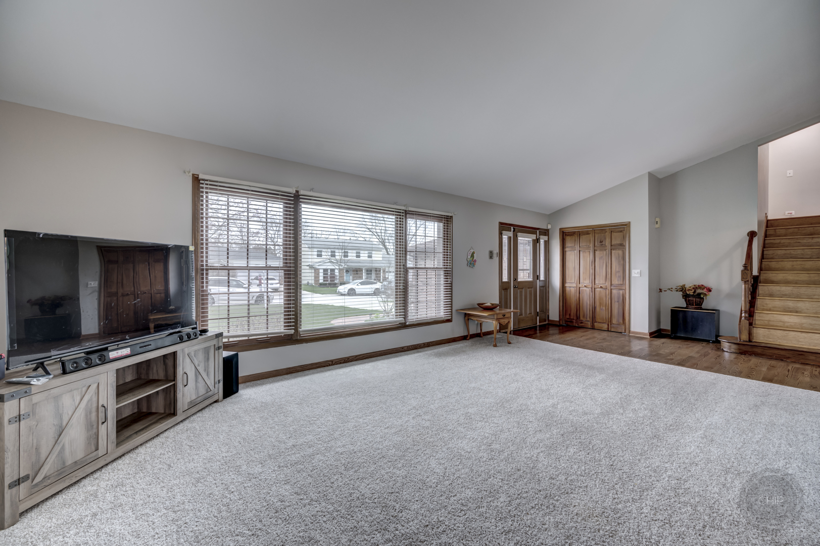 2820 Sun Valley Road Lisle, IL 60532 - Photo 6 of 46 a view of a livingroom with furniture and a flat screen tv