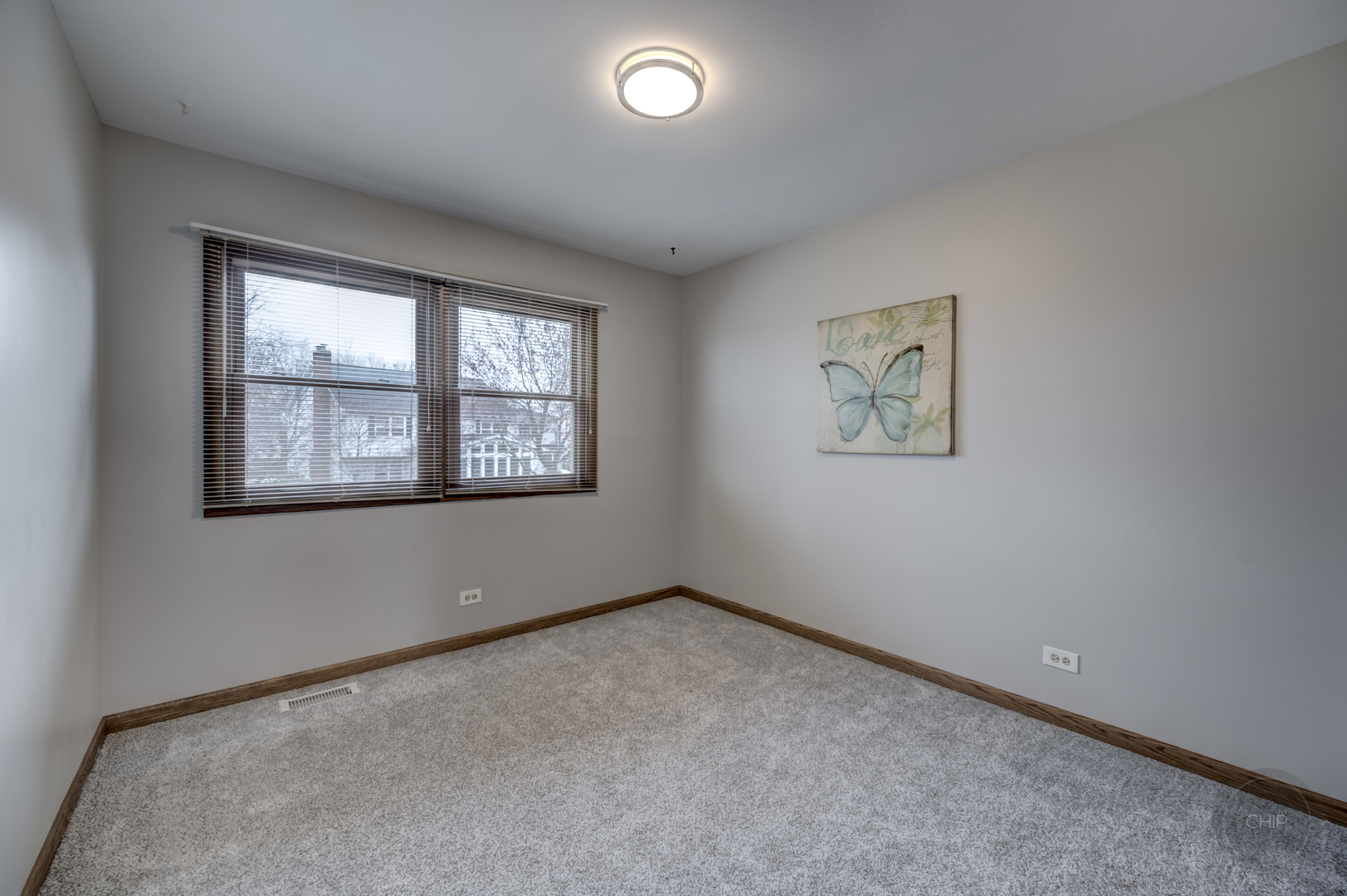 2820 Sun Valley Road Lisle, IL 60532 - Photo 8 of 46 an empty room with a window