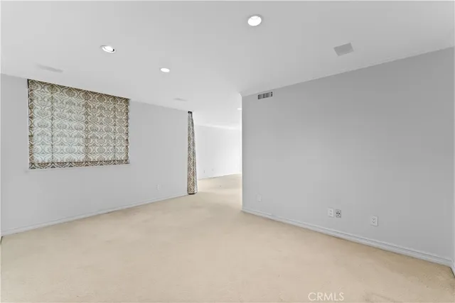 a view of a room with large windows