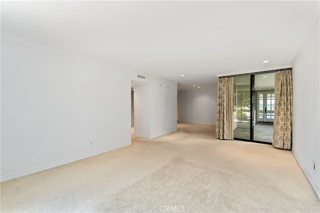 a spacious bathroom with a tub sink and mirror