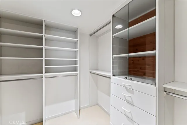 a view of an empty walk in closet