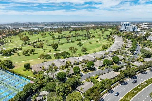 a kitchen with stainless steel appliances kitchen island granite countertop a stove a sink and a chandelier