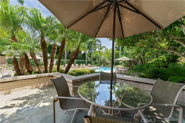 a swimming pool with outdoor seating yard and outdoor seating