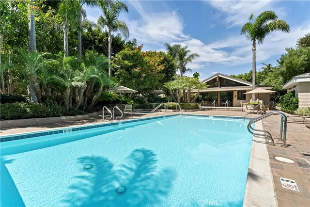 a wooden bench sitting in front of a building