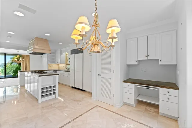 a kitchen with a refrigerator and a sink