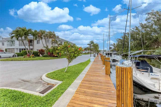 a view of swimming pool with outdoor seating and plants