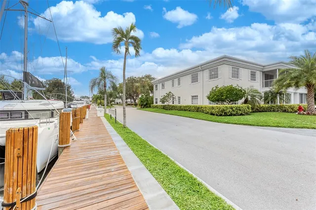 a swimming pool with outdoor seating and yard