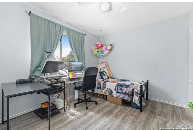 a workspace with furniture and wooden floor