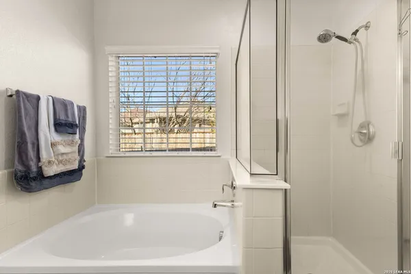 a bathroom with a sink double vanity and a mirror