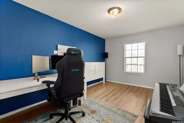 a view of a patio with a table and chairs