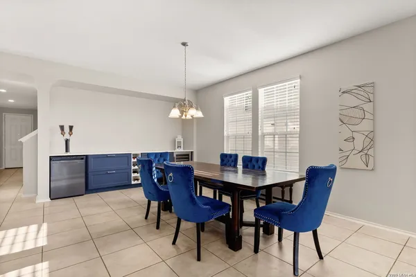 a room with a cabinet and a potted plant