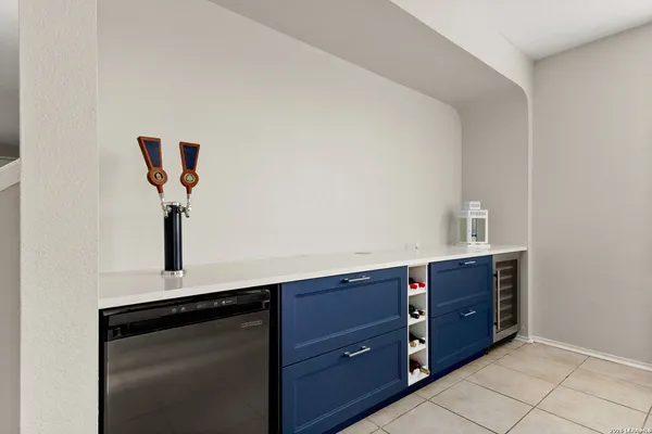 a kitchen with a sink a stove top oven and cabinets