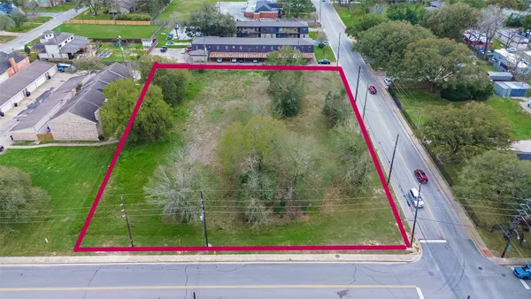 a view of swimming pool with a yard and potted plants