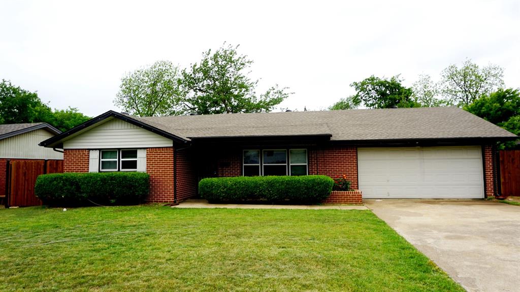 7108 Rockdale Road Fort Worth, TX 76134 - Photo 1 of 1 a front view of a house with garden