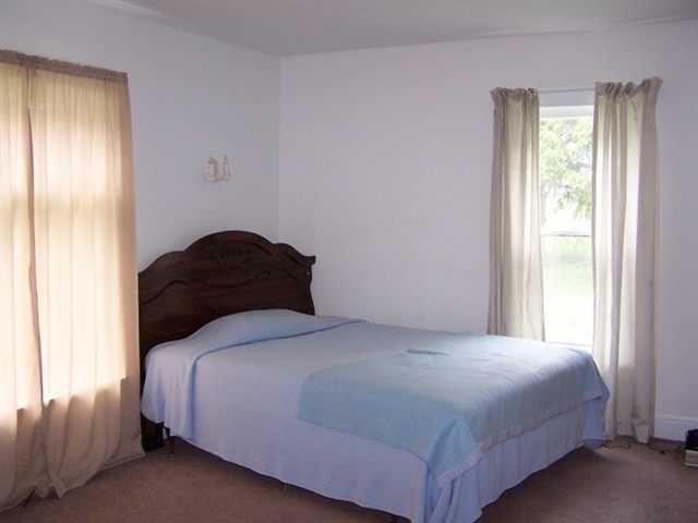 18695 Cyclone Ridge Road Mount Carroll, IL 61053 - Photo 3 of 5 a bedroom with a bed and a window