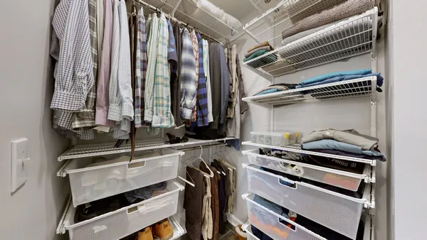 a view of a patio with couches and potted plants