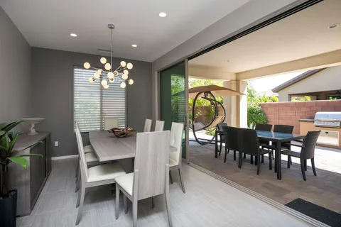 a view of a dining room with furniture window and outside view