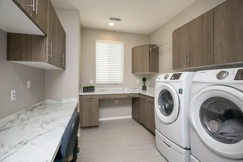 a view of a kitchen with washer and dryer