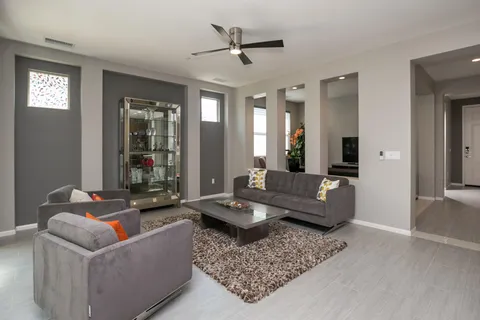 a living room with furniture and a large window