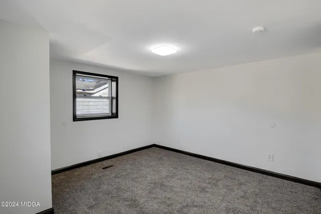 a view of an empty room and closet