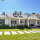 a view of a house with swimming pool and yard