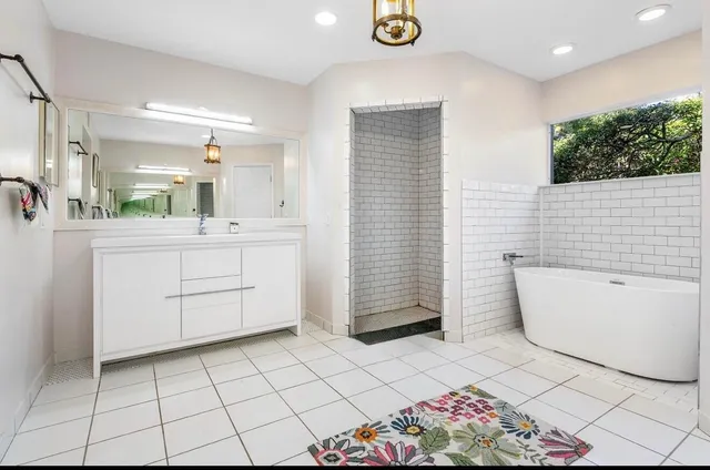 a bathroom with a toilet a sink and a mirror