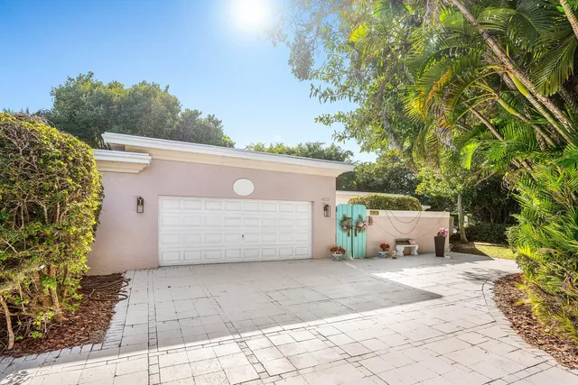 a view of gym equipment with wooden floor and windows