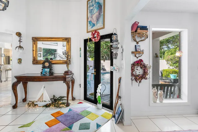 a view of a dining room with furniture and a window