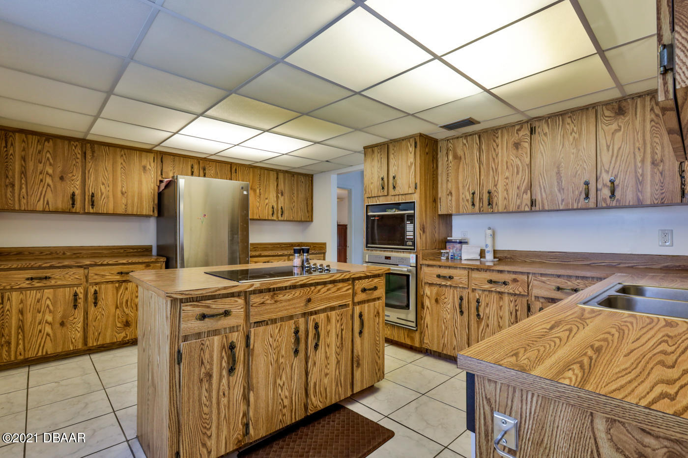 2629 Mango Tree Drive Edgewater, FL 32141 - Photo 11 of 30 a kitchen with appliances cabinets and furniture