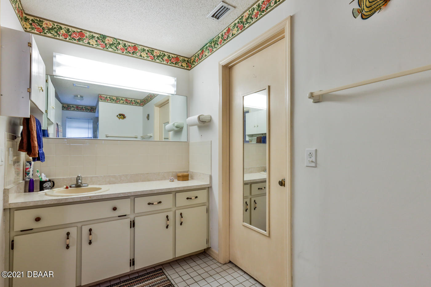 2629 Mango Tree Drive Edgewater, FL 32141 - Photo 14 of 30 a spacious bathroom with a double vanity sink and a mirror