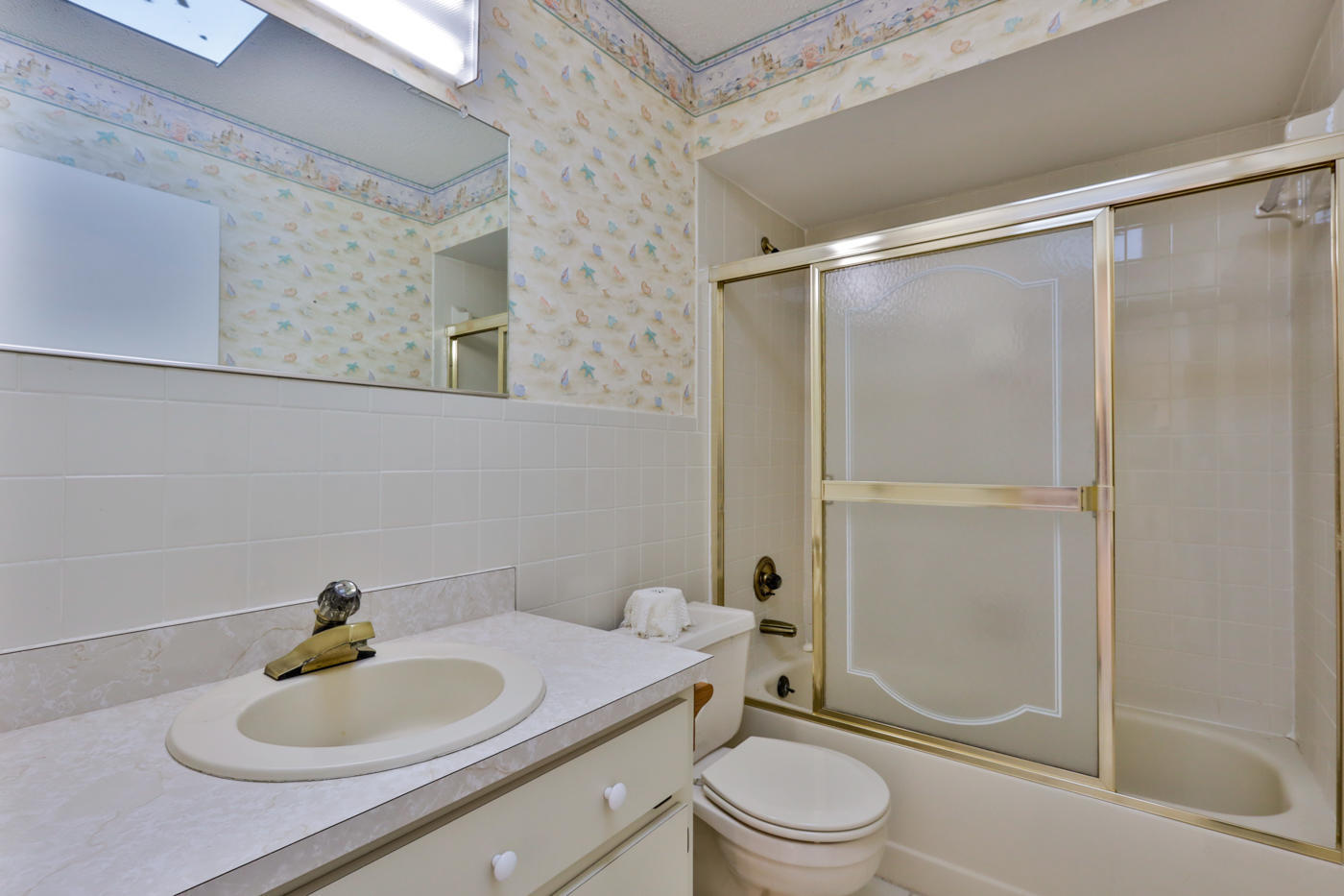 2629 Mango Tree Drive Edgewater, FL 32141 - Photo 17 of 30 a bathroom with a sink a toilet and shower