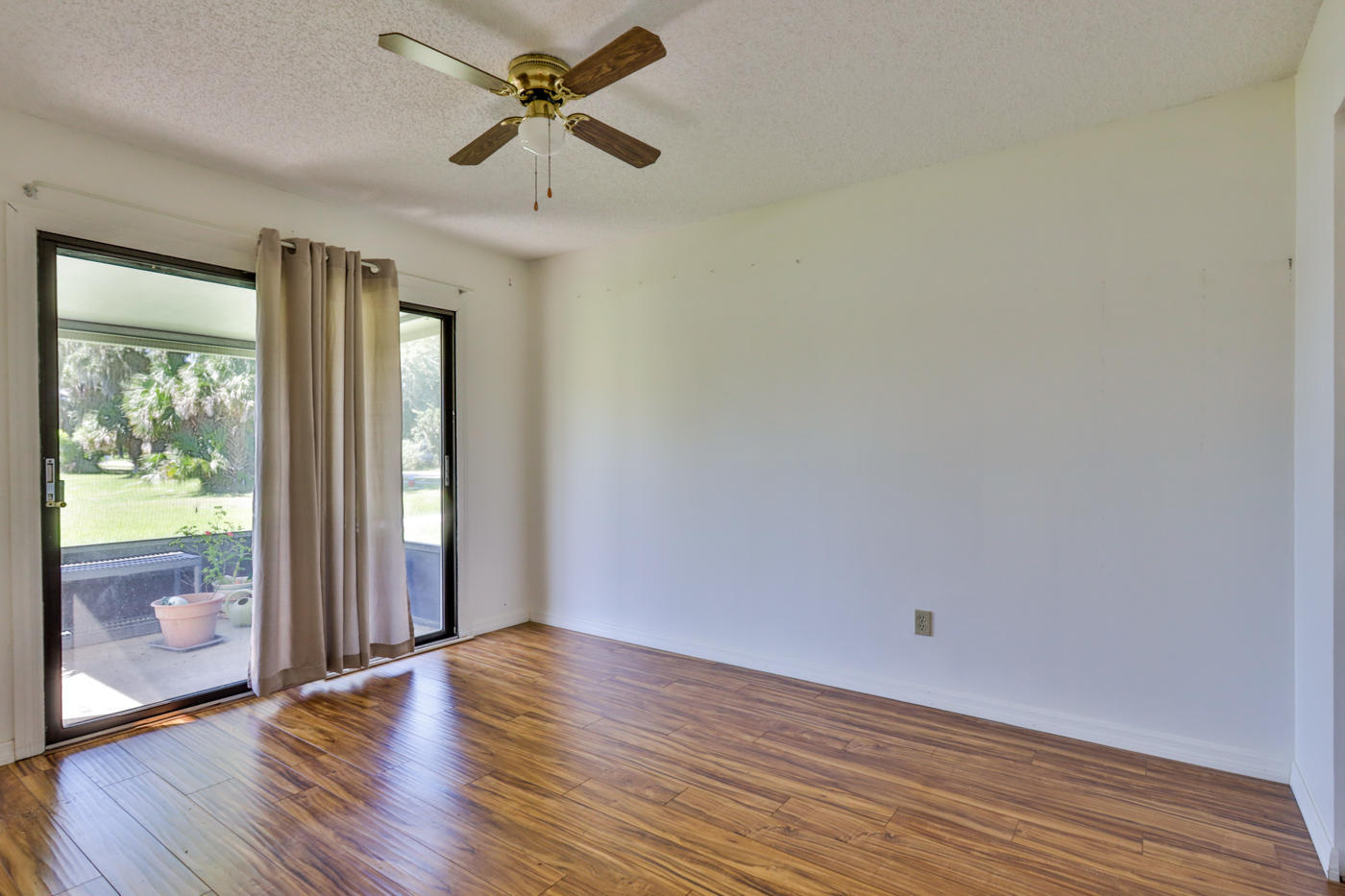 2629 Mango Tree Drive Edgewater, FL 32141 - Photo 18 of 30 wooden floor in an empty room with a window