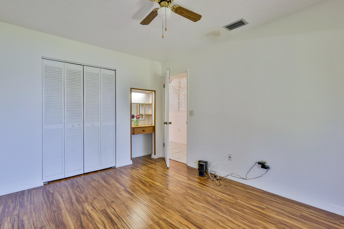 2629 Mango Tree Drive Edgewater, FL 32141 - Photo 19 of 30 a view of empty room with wooden floor and fan
