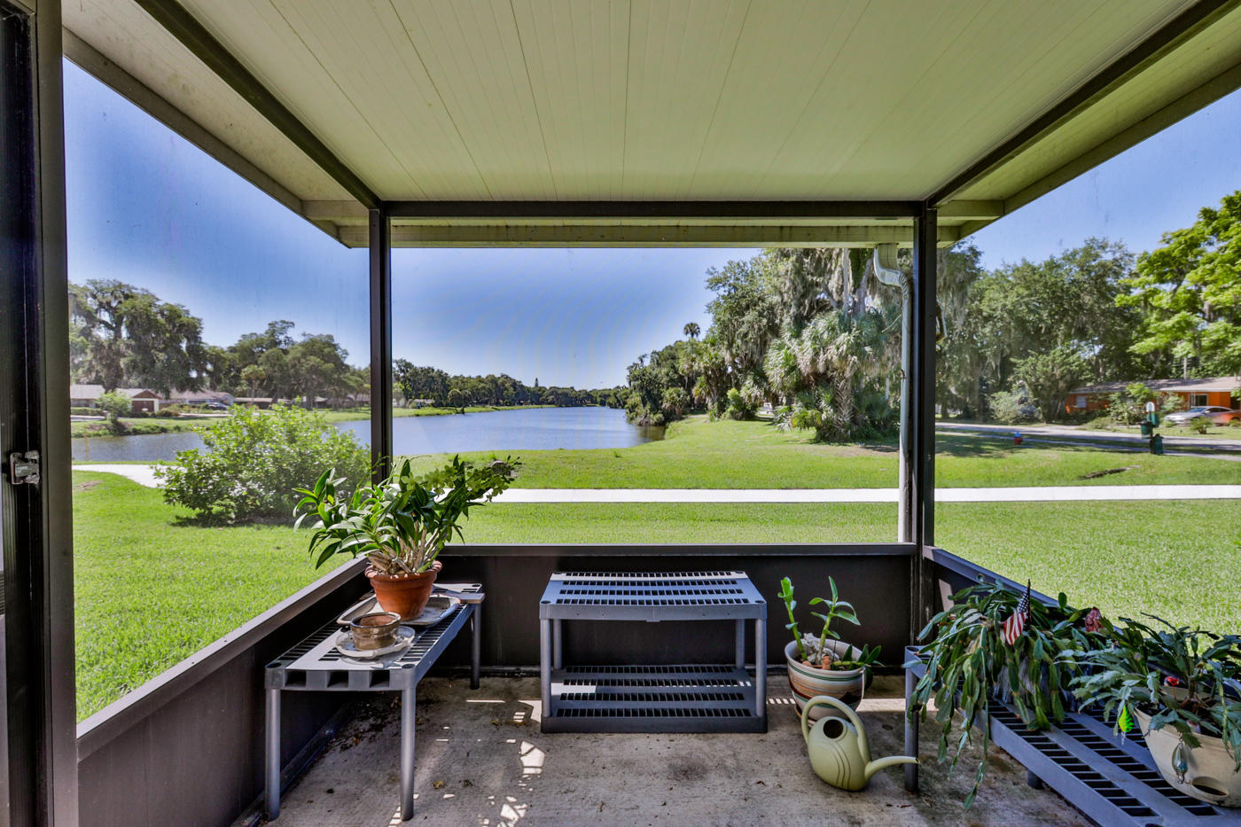2629 Mango Tree Drive Edgewater, FL 32141 - Photo 20 of 30 a backyard of a house with a garden and outdoor seating