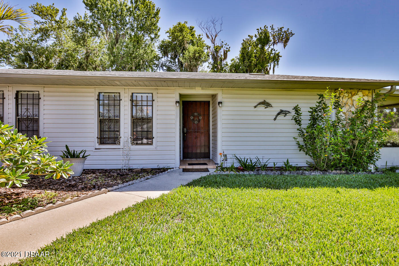 2629 Mango Tree Drive Edgewater, FL 32141 - Photo 28 of 30 front view of a house with a yard
